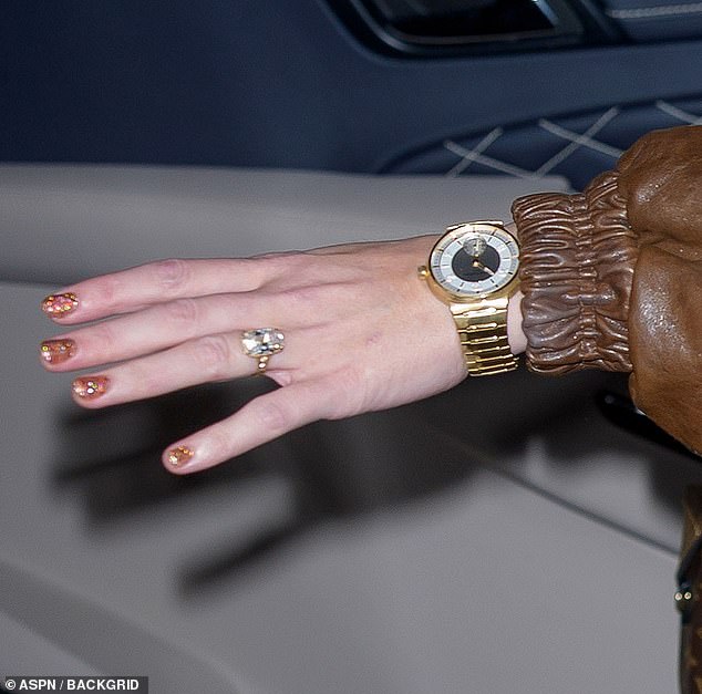 Taylor Swift shows off engagement ring and her long legs on girls' night out after Travis Kelce's ex takes swipe